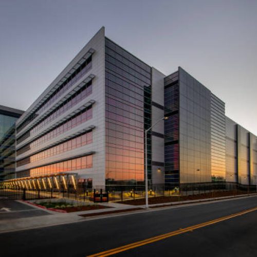 Large office building at sunset.